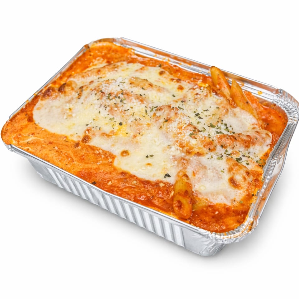 Baked ziti with melted cheese and red sauce in a foil takeout container from Rocco's NY Pizzeria & Pasta.
